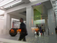 Visitors are seen refelcted in a window at the opening of the new Museum of Modern Art (Muzeum Sztuki Nowoczesnej) in Warsaw, Poland on 25 O...