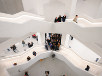 Visitors are seen on the evening of the opening of the new Museum of Modern Art (Muzeum Sztuki Nowoczesnej) in Warsaw, Poland on 25 October,...