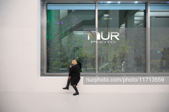 A photographer is seen at the opening of the new Museum of Modern Art (Muzeum Sztuki Nowoczesnej) in Warsaw, Poland on 25 October, 2024. 