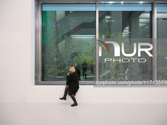 A photographer is seen at the opening of the new Museum of Modern Art (Muzeum Sztuki Nowoczesnej) in Warsaw, Poland on 25 October, 2024. (