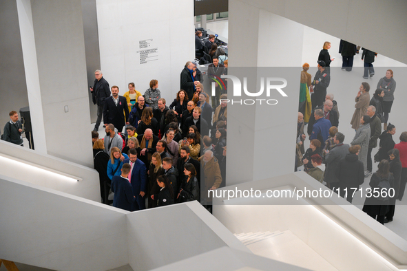 Visitors are seen on the evening of the opening of the new Museum of Modern Art (Muzeum Sztuki Nowoczesnej) in Warsaw, Poland on 25 October,...