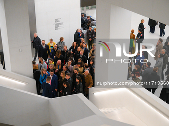 Visitors are seen on the evening of the opening of the new Museum of Modern Art (Muzeum Sztuki Nowoczesnej) in Warsaw, Poland on 25 October,...