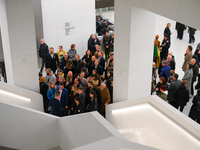 Visitors are seen on the evening of the opening of the new Museum of Modern Art (Muzeum Sztuki Nowoczesnej) in Warsaw, Poland on 25 October,...