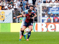 Andrea Pinamonti of Genoa CFC and Mario Gila of SS Lazio compete for the ball during the Serie A Enilive match between SS Lazio and Genoa CF...