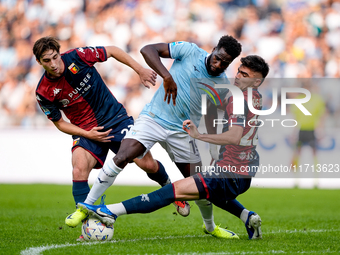 Boulaye Dia of SS Lazio is challenged by Fabio Miretti of Genoa CFC and Johan Vasquez during the Serie A Enilive match between SS Lazio and...