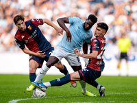 Boulaye Dia of SS Lazio is challenged by Fabio Miretti of Genoa CFC and Johan Vasquez during the Serie A Enilive match between SS Lazio and...