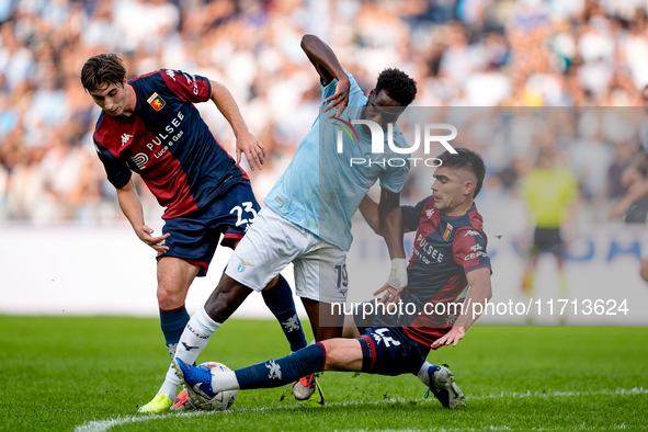 Boulaye Dia of SS Lazio is challenged by Fabio Miretti of Genoa CFC and Johan Vasquez during the Serie A Enilive match between SS Lazio and...