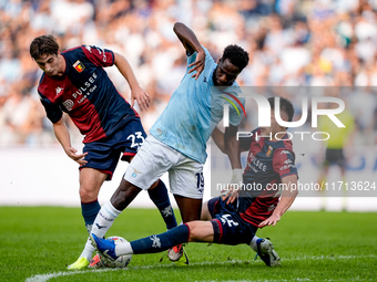 Boulaye Dia of SS Lazio is challenged by Fabio Miretti of Genoa CFC and Johan Vasquez during the Serie A Enilive match between SS Lazio and...