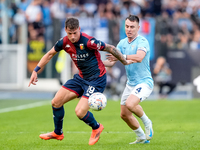 Andrea Pinamonti of Genoa CFC and Gil Patric of SS Lazio compete for the ball during the Serie A Enilive match between SS Lazio and Genoa CF...