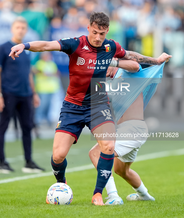 Andrea Pinamonti of Genoa CFC and Gil Patric of SS Lazio compete for the ball during the Serie A Enilive match between SS Lazio and Genoa CF...