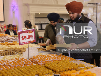 People purchase traditional Indian sweets at a sweet shop for the upcoming festival of Diwali in Mississauga, Ontario, Canada, on October 26...