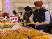 People purchase traditional Indian sweets at a sweet shop for the upcoming festival of Diwali in Mississauga, Ontario, Canada, on October 26...