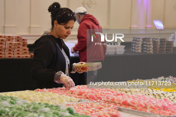 People purchase traditional Indian sweets at a sweet shop for the upcoming festival of Diwali in Mississauga, Ontario, Canada, on October 26...