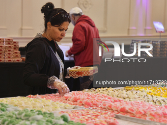 People purchase traditional Indian sweets at a sweet shop for the upcoming festival of Diwali in Mississauga, Ontario, Canada, on October 26...