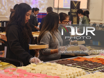 People purchase traditional Indian sweets at a sweet shop for the upcoming festival of Diwali in Mississauga, Ontario, Canada, on October 26...