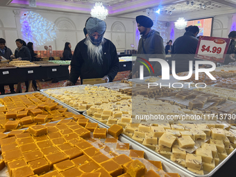 People purchase traditional Indian sweets at a sweet shop for the upcoming festival of Diwali in Mississauga, Ontario, Canada, on October 26...