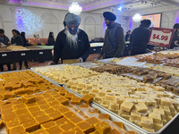 People purchase traditional Indian sweets at a sweet shop for the upcoming festival of Diwali in Mississauga, Ontario, Canada, on October 26...