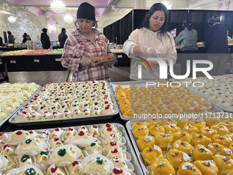 People purchase traditional Indian sweets at a sweet shop for the upcoming festival of Diwali in Mississauga, Ontario, Canada, on October 26...