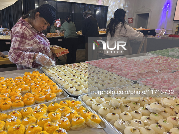 People purchase traditional Indian sweets at a sweet shop for the upcoming festival of Diwali in Mississauga, Ontario, Canada, on October 26...