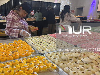 People purchase traditional Indian sweets at a sweet shop for the upcoming festival of Diwali in Mississauga, Ontario, Canada, on October 26...