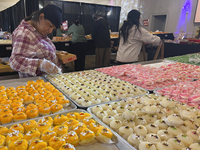 People purchase traditional Indian sweets at a sweet shop for the upcoming festival of Diwali in Mississauga, Ontario, Canada, on October 26...