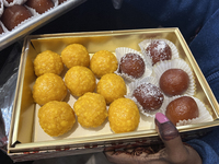 A woman purchases traditional Indian sweets at a sweet shop for the upcoming festival of Diwali in Mississauga, Ontario, Canada, on October...