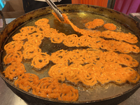 A man fries jalebis (a traditional Indian sweet) at a sweet shop for the upcoming festival of Diwali in Mississauga, Ontario, Canada, on Oct...