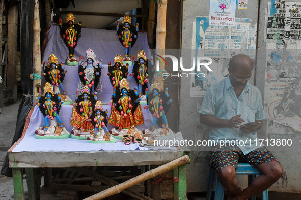 A man sells idols of Goddess Kali ahead of the Kali Puja festival in Kolkata, India, on October 27, 2024. 