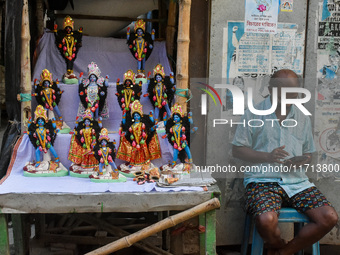 A man sells idols of Goddess Kali ahead of the Kali Puja festival in Kolkata, India, on October 27, 2024. (