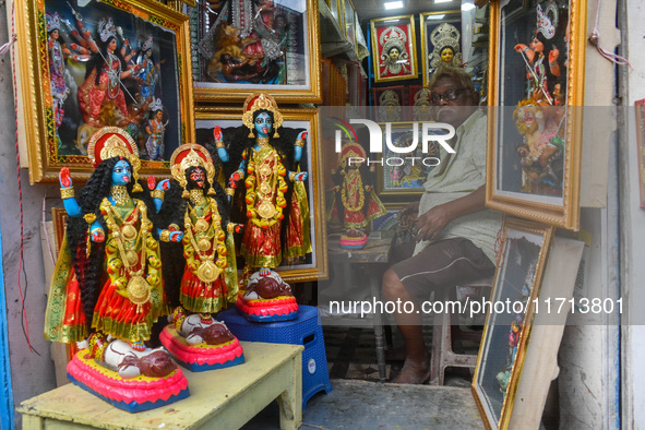 A man sells idols of Goddess Kali ahead of the Kali Puja festival in Kolkata, India, on October 27, 2024. 