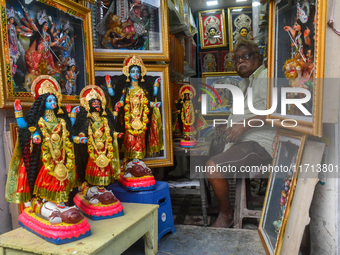 A man sells idols of Goddess Kali ahead of the Kali Puja festival in Kolkata, India, on October 27, 2024. (