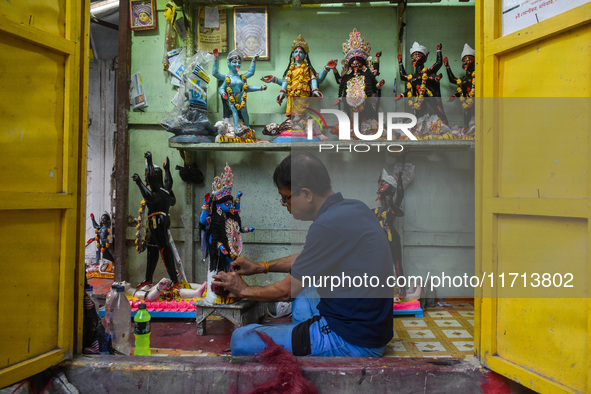 Artisans and workers make idols of Goddess Kali ahead of the Kali Puja festival in Kolkata, India, on October 27, 2024. 