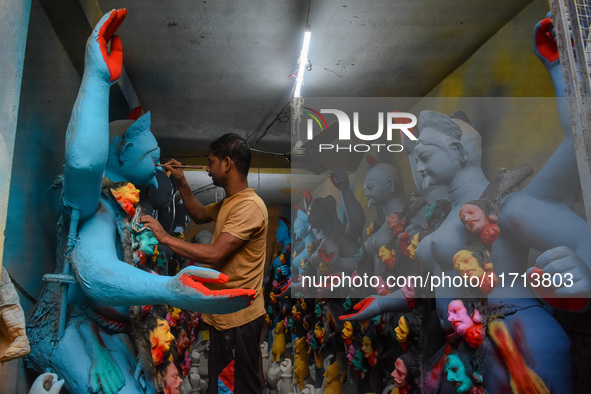 Artisans and workers make idols of Goddess Kali ahead of the Kali Puja festival in Kolkata, India, on October 27, 2024. 