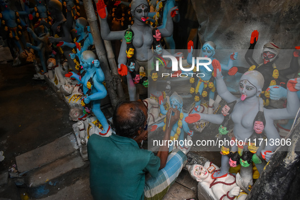 Artisans and workers make idols of Goddess Kali ahead of the Kali Puja festival in Kolkata, India, on October 27, 2024. 