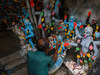 Artisans and workers make idols of Goddess Kali ahead of the Kali Puja festival in Kolkata, India, on October 27, 2024. (