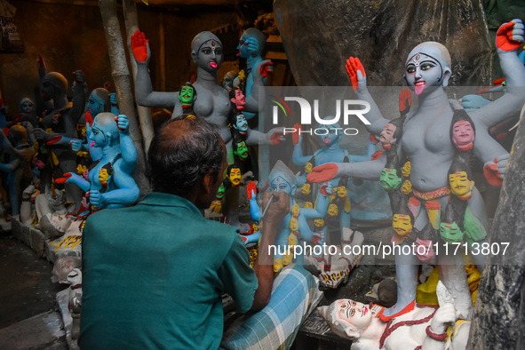 Artisans and workers make idols of Goddess Kali ahead of the Kali Puja festival in Kolkata, India, on October 27, 2024. 