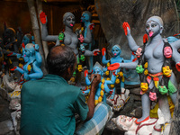 Artisans and workers make idols of Goddess Kali ahead of the Kali Puja festival in Kolkata, India, on October 27, 2024. (