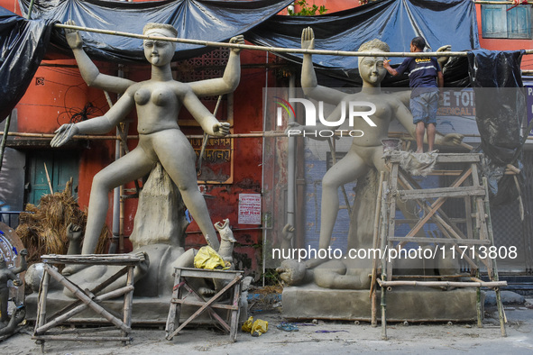 Artisans and workers make idols of Goddess Kali ahead of the Kali Puja festival in Kolkata, India, on October 27, 2024. 