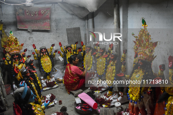 Artisans and workers make idols of Goddess Kali ahead of the Kali Puja festival in Kolkata, India, on October 27, 2024. 