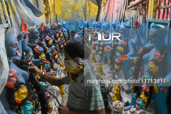 Artisans and workers make idols of Goddess Kali ahead of the Kali Puja festival in Kolkata, India, on October 27, 2024. 