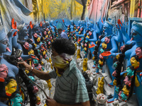 Artisans and workers make idols of Goddess Kali ahead of the Kali Puja festival in Kolkata, India, on October 27, 2024. (