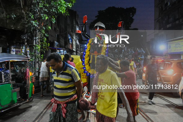 Artisans and workers make idols of Goddess Kali ahead of the Kali Puja festival in Kolkata, India, on October 27, 2024. 