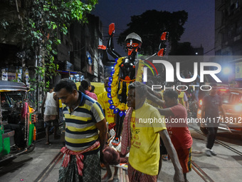 Artisans and workers make idols of Goddess Kali ahead of the Kali Puja festival in Kolkata, India, on October 27, 2024. (