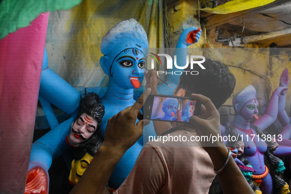 Artisans and workers make idols of Goddess Kali ahead of the Kali Puja festival in Kolkata, India, on October 27, 2024. 