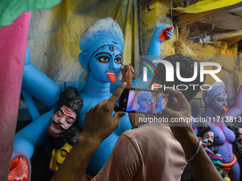 Artisans and workers make idols of Goddess Kali ahead of the Kali Puja festival in Kolkata, India, on October 27, 2024. (