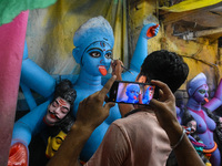 Artisans and workers make idols of Goddess Kali ahead of the Kali Puja festival in Kolkata, India, on October 27, 2024. (