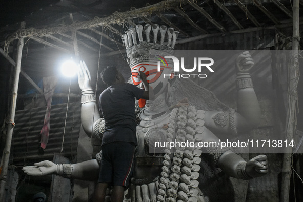 Artisans and workers make idols of Goddess Kali ahead of the Kali Puja festival in Kolkata, India, on October 27, 2024. 