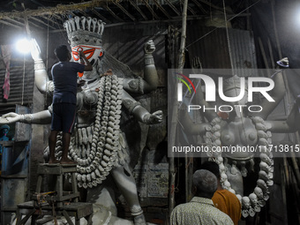 Artisans and workers make idols of Goddess Kali ahead of the Kali Puja festival in Kolkata, India, on October 27, 2024. (