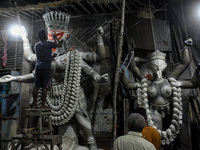 Artisans and workers make idols of Goddess Kali ahead of the Kali Puja festival in Kolkata, India, on October 27, 2024. (