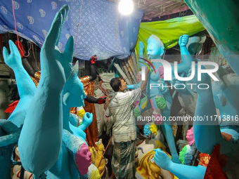 Artisans and workers make idols of Goddess Kali ahead of the Kali Puja festival in Kolkata, India, on October 27, 2024. (